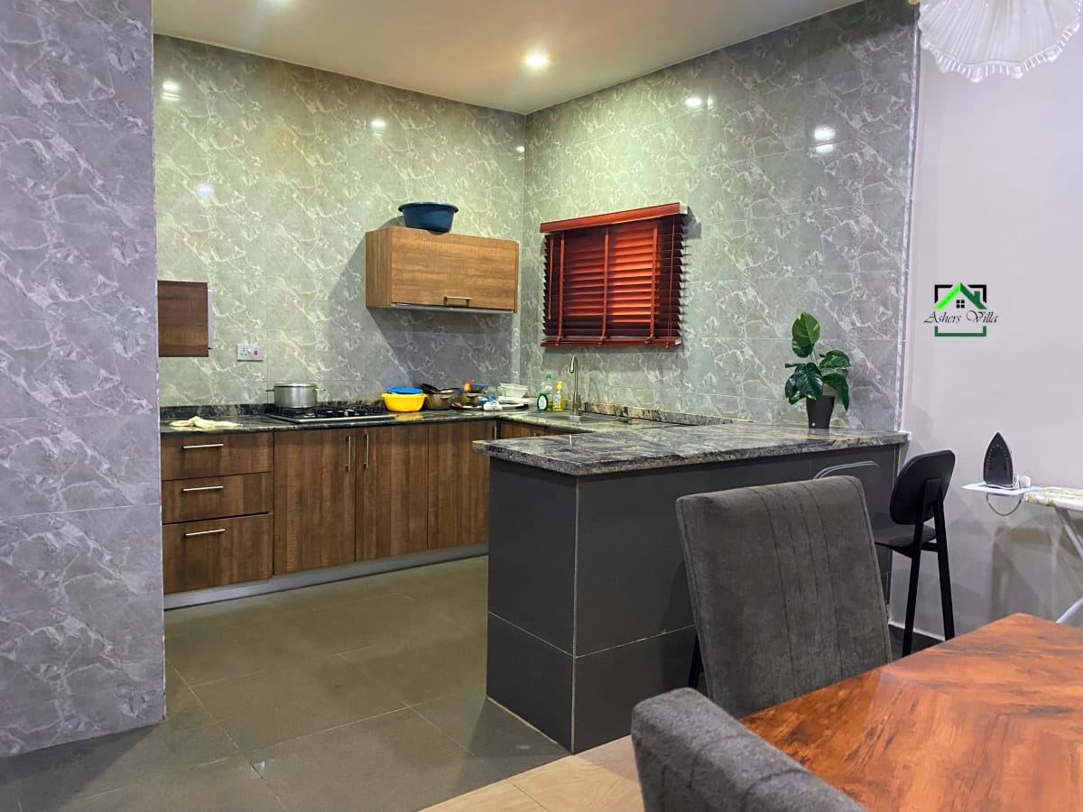 Asher's Villa luxury accommodation in Abuja - Modern kitchen with premium countertops and elegant cabinetry
