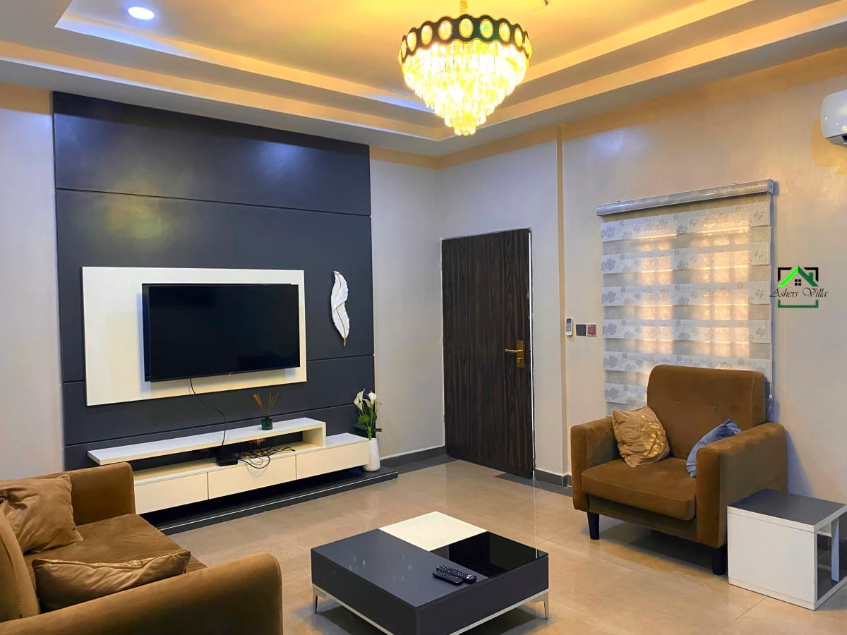 Asher's Villa living area - Contemporary living space with comfortable seating and entertainment system